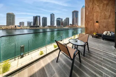 a balcony with a view of the water at Peninsula Five 3BD Duplex with Lake view, For 9 in Dubai