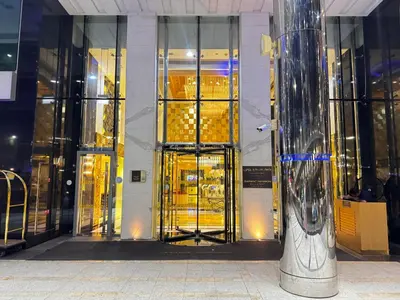 a store front with a revolving door in a building at 1BR Full Burj View 1 min to Dubai Mall Arabic Vibe in Dubai