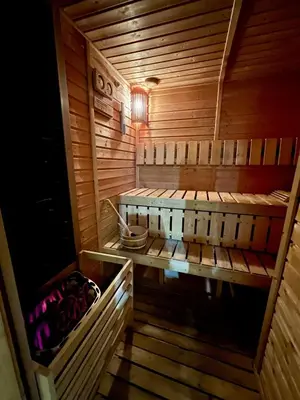 a wooden sauna with a bench in the middle at Cozy Marina Studio, Canal View with a Balcony in Dubai