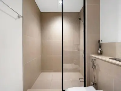 a bathroom with a shower with a toilet and a sink at Mahogany 16 - 1BR 4 Guests - Walk to Burj Khalifa in Dubai