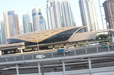 a large building in a city with tall buildings at Modern Studio in Marina in Dubai
