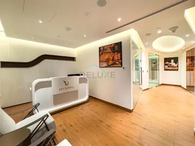 a room with a salon with a couch and a table at Spacious Balcony with Private Jacuzzi and Stunning Views, Easy Public Transport Access, Terraces Marasi Drive, Business Bay by Deluxe Holiday Homes in Dubai