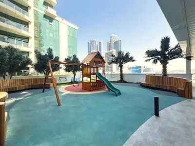 a playground in a building with a slide at Spacious Balcony with Private Jacuzzi and Stunning Views, Easy Public Transport Access, Terraces Marasi Drive, Business Bay by Deluxe Holiday Homes in Dubai