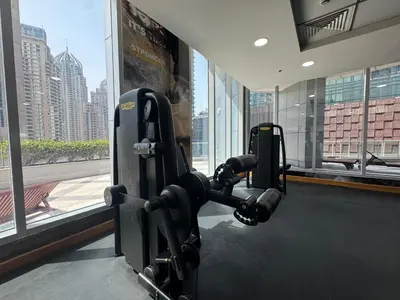 a gym with a view of a city at Exclusive Torch Tower Penthouse In Dubai Marina in Dubai