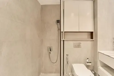 a bathroom with a shower and a toilet and a sink at Exclusive Torch Tower Penthouse In Dubai Marina in Dubai