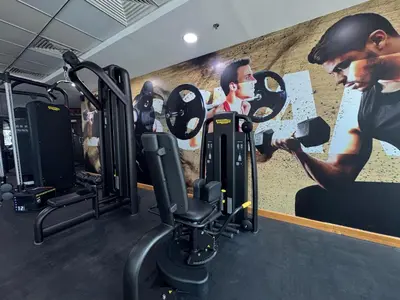 a gym with cardio equipment in front of a painting at Exclusive Torch Tower Penthouse In Dubai Marina in Dubai