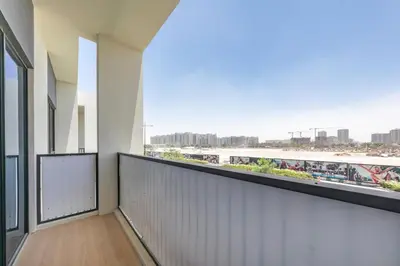 a balcony with a view of the city at Luxury Villa 3BR with garden in Dubai