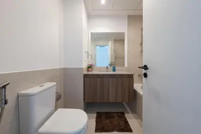 a bathroom with a toilet and a sink at Luxury Villa 3BR with garden in Dubai