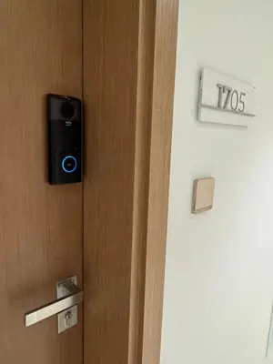 a smart door with a phone on it at Luxury Studio Burj Khalifa View in Dubai