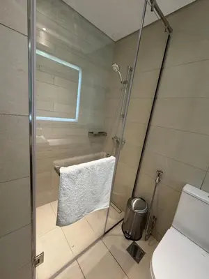 a bathroom with a shower and a toilet at Luxury Studio Burj Khalifa View in Dubai