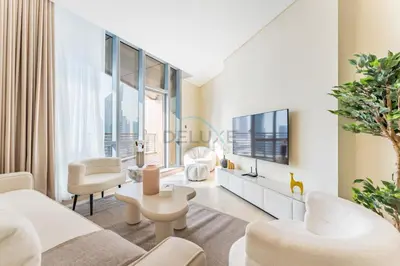 a living room with white furniture and large windows at Iconic Views of the Future Museum, Minutes from Metro & Key Attractions, Sky Gardens, DIFC by Deluxe Holiday Homes in Dubai