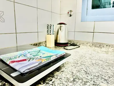 a kitchen counter with a tray with utensils on it at 5 mins walk to Burjuman metro in Dubai