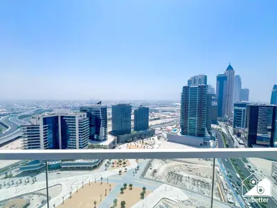 a view of a city with tall buildings at Skyline Studio Escape l Balcony , Gym & Pool in Dubai