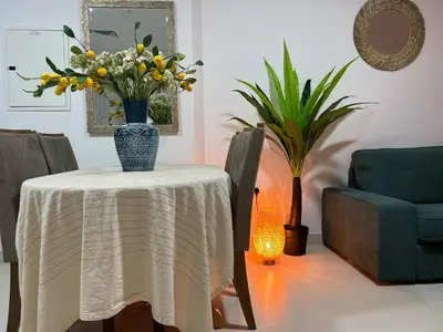 a table with a vase of flowers on it at 1 min to ADCB metro New home in Dubai