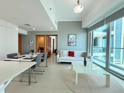 a living room with a couch and a table at Ocean Heights New 2BDR with full Sea & Dubai Eye view in Marina by Simplex Home in Dubai