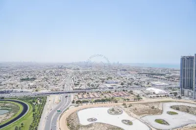 an aerial view of a city with buildings and roads at Luxury 2BR with Burj and Ocean Views in Dubai