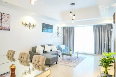 a living room with a couch and a table at Luxury 2BR with Burj and Ocean Views in Dubai