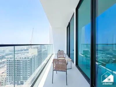a balcony with a chair on the top of a building at Luxury & Comfort 1B at Binghatti Amber & Balcony in Dubai