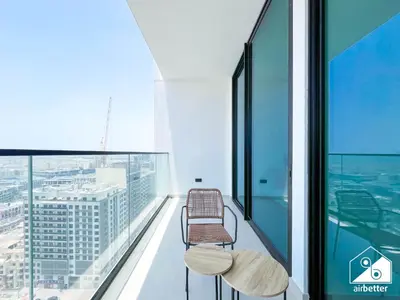 a balcony with two benches on top of a building at Luxury & Comfort 1B at Binghatti Amber & Balcony in Dubai