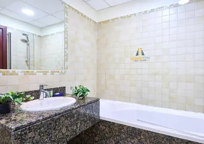 a bathroom with a sink and a bath tub at Beachfront 2BR, Sea & Ain Dubai View, JBR Walk Hosted by Desert City Stays in Dubai