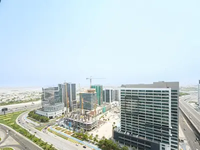 an aerial view of a city with tall buildings at Luxury Smart 1BR -High Floor Business Bay Views in Dubai