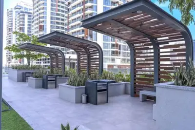 a group of benches with plants in them at Vogue Al Wasl 1 Residences Near Zabeel Park and World Trade Centre, One Bedroom Apartment with Balcony and City View, Access to all Amenities, Walkable to Max Fashion Metro Station in Dubai