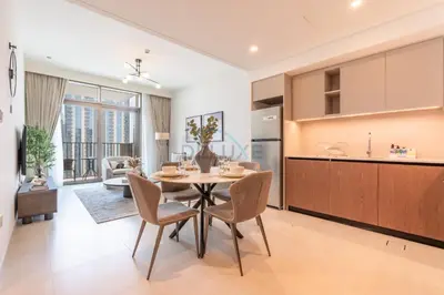 a kitchen and dining room with a table and chairs at Harbourfront Views 1BR, Near Park and Minutes from Festival City Mall, Creek Palace, Dubai Creek Harbour by Deluxe Holiday Homes in Dubai