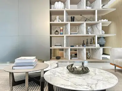 a living room with a table and books at BLVD - Urban Oasis Missoni 10 - Min to Dubai Mall in Dubai