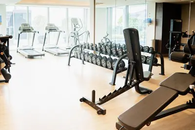 a gym with several treadmills and exercise bikes at Elegant 1BR with Canal Views in Business Bay in Dubai