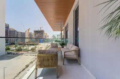 a balcony with furniture and a view of the city at Oxford Luxury 1 bedroom & study in Dubai