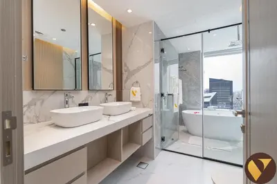 a bathroom with two sinks and a tub and a shower at Vogue Marina JW Marriott with Direct Access to Marina Mall, Studio Apartment with Balcony and Marina Skyline View, Access to all Amenities in Dubai
