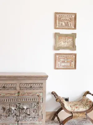 a chair sitting next to a dresser in a room at Spacious 2BR Steps from Downtown in Dubai