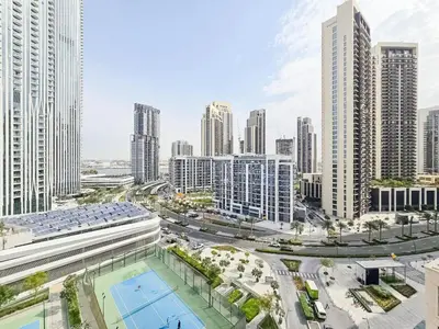 an aerial view of a city with tall buildings at Deluxe 1-Bedroom in The Grand - Waterfront and Skyline Views in Dubai