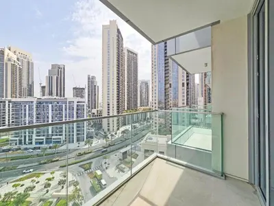 an apartment balcony with a view of the city at Deluxe 1-Bedroom in The Grand - Waterfront and Skyline Views in Dubai