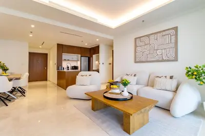 a living room with a couch and a table at Lux and Spacious 1 Bed with Beach in Dubai