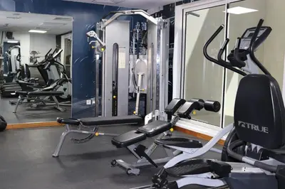a gym with several treadmills and cardio machines at Water View I Chic 1BR I Mayfair I 3 Sleeps I Fast Wi-Fi I Walkable Area in Dubai