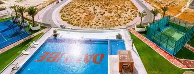 an overhead view of a large swimming pool at Luxury Studio with Gym, Pool & Badminton Court in Dubai