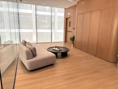 a living room with a chair and a coffee table at Binghatti Galaxy 2 in Dubai