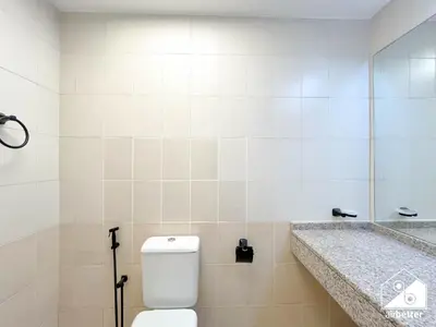 a bathroom with a toilet and a sink at Stylish JVC Duplex l Gym, Pool & Parking in Dubai