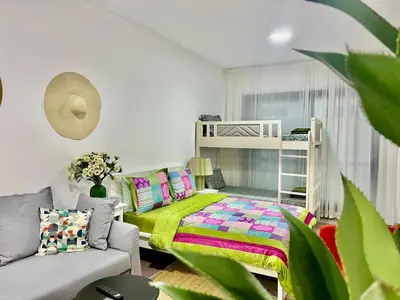 a bedroom with a bed and a bunk bed at Sleep 6 Mina Road in Dubai