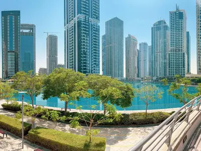 a view of a city skyline with tall buildings at Cozy Studio with Sofa bed beside DMCC Metro & Dubai Marina in Dubai