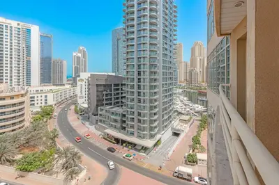 a view of a city with tall buildings at Spacious 1BR in Great Location, Manchester Tower, Dubai Marina in Dubai