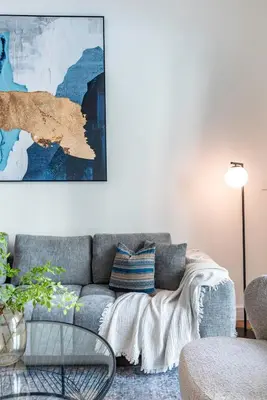 a living room with a couch and a table at Relax & Unwind with Dubai Creek Vibes in Dubai