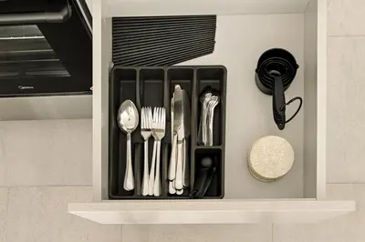 a drawer filled with utensils in a kitchen at New 2.5 BR Villa With PS5 and Garden Near Dubai Mall in Dubai