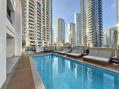a swimming pool on the roof of a building at Vacationer l Vibrant 2 Bedroom l Pool with Burj Khalifa View in Dubai