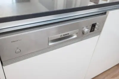 a close up of a dishwasher in a kitchen at Palm Jumeirah Luxury Apt Direct Beach Access & Views in Dubai