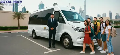a group of people standing in front of a white van at Royal Rider Bus rental Dubai in Dubai