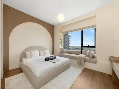 a bedroom with a large bed and a large window at Dubai Hills 2BR Full Park View and Designer Style in Dubai