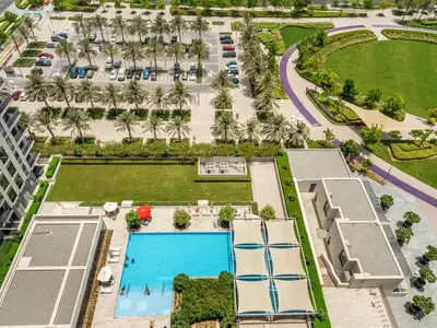 an overhead view of the pool at a resort at Dubai Hills 2BR Full Park View and Designer Style in Dubai