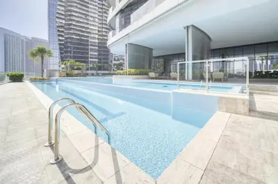 a swimming pool on the side of a building at Luxe 1BR in RP Heights Downtown - 50mt to Dubai Mall, walk to Burj Khalifa and Fountain in Dubai